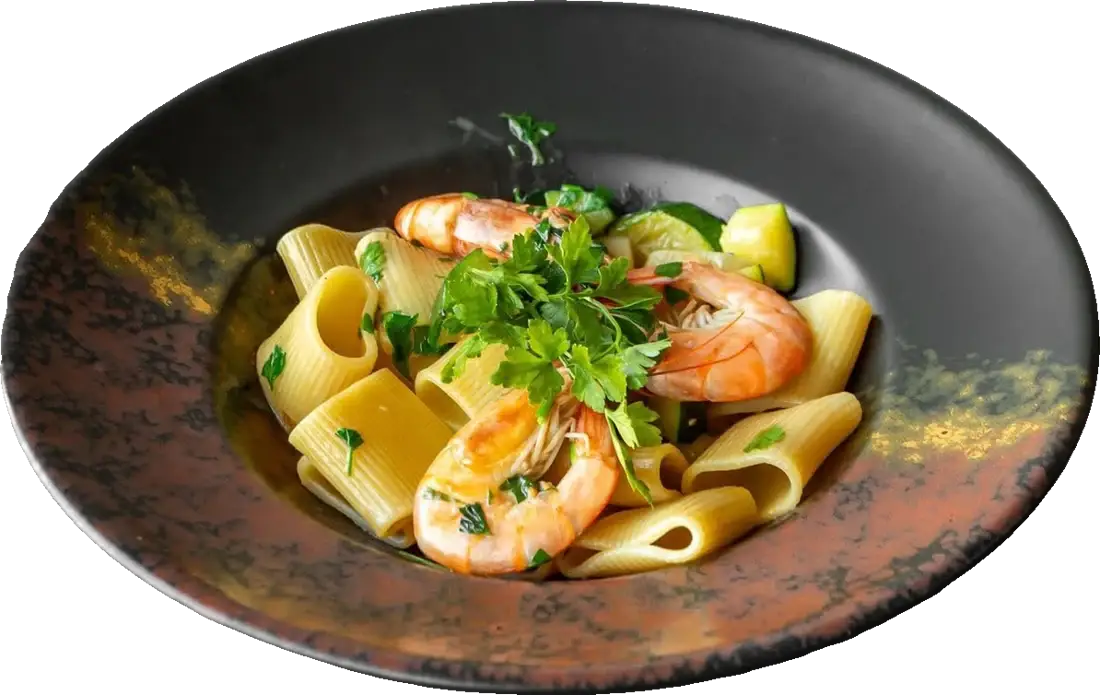 Paccheri with king prawns, courgette and tomato sauce.